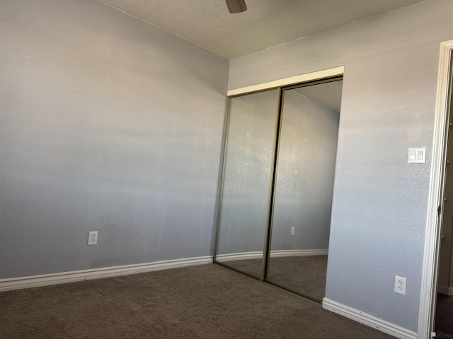 10310 E 37th Pl, Yuma, AZ 85365 - unfurnished bedroom featuring carpet flooring, a closet, and a ceiling fan