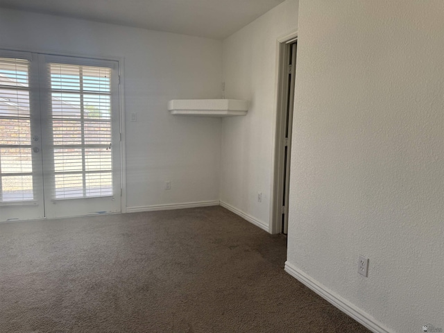 10310 E 37th Pl, Yuma, AZ 85365 - empty room with dark colored carpet and healthy amount of natural light