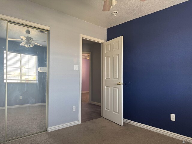 10310 E 37th Pl, Yuma, AZ 85365 - unfurnished bedroom featuring a closet, carpet floors, ceiling fan, and a textured ceiling