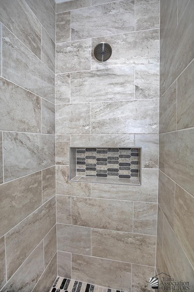 details featuring a tile shower