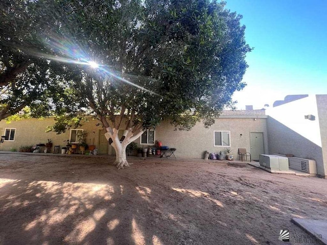 224 Somerton Avenue 224 & 230N. Somerton Ave, Somerton, AZ 85350 - back of house with a chimney and stucco siding