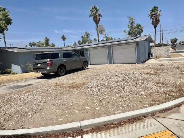 2681 S Walnut Ave, Yuma, AZ 85364 - garage with solar panels and driveway