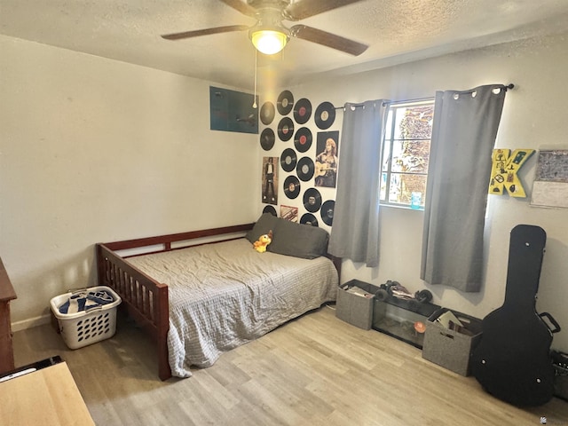 2681 S Walnut Ave, Yuma, AZ 85364 - bedroom with wood finished floors, a textured ceiling, and ceiling fan