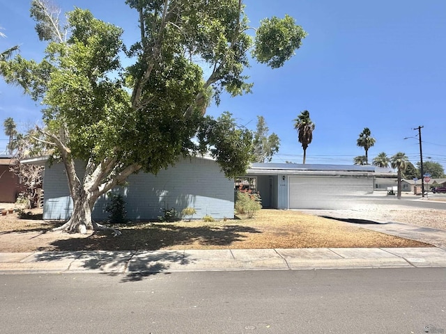 2681 S Walnut Ave, Yuma, AZ 85364 - view of front of home with solar panels, a garage, and driveway