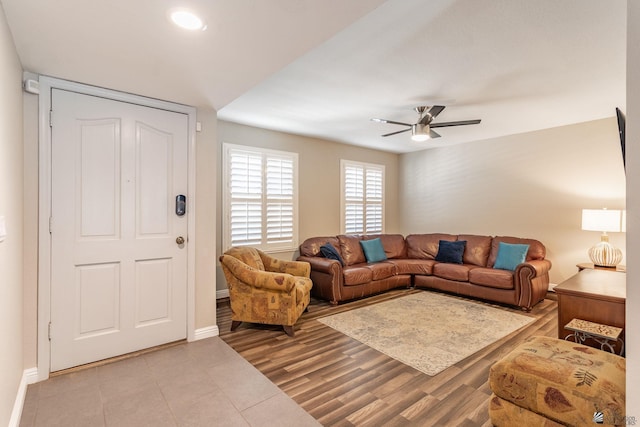 living area with light tile patterned floors, baseboards, recessed lighting, and ceiling fan