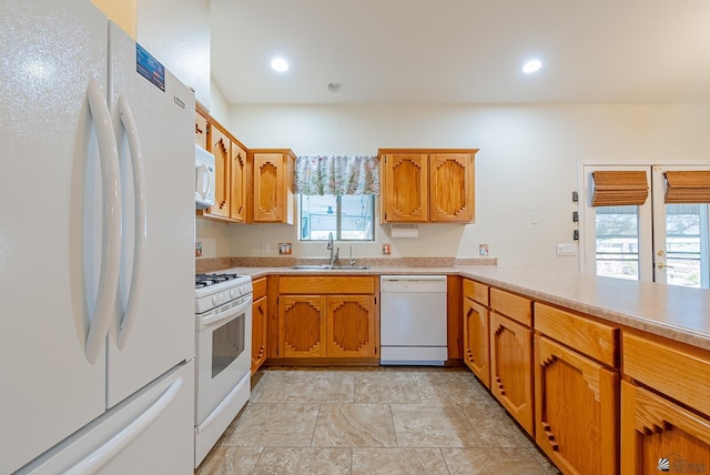 13736 S Chase Way, Yuma, AZ 85367 - kitchen featuring stone finish floor, white appliances, a sink, brown cabinets, and light countertops