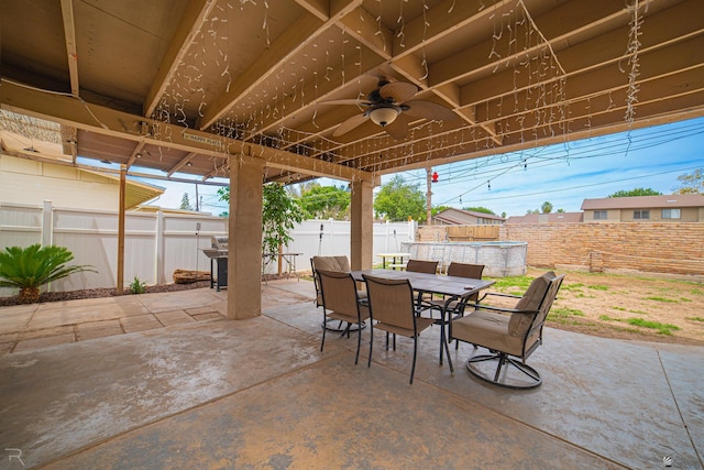 2556 W 14th St, Yuma, AZ 85364 - fenced backyard with outdoor dining area, ceiling fan, and a patio area