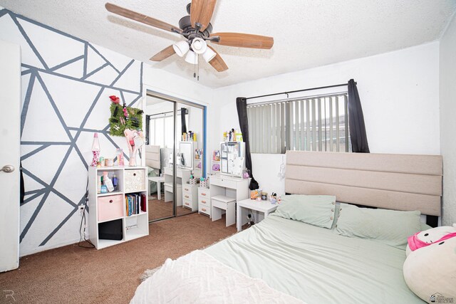 2556 W 14th St, Yuma, AZ 85364 - bedroom with a textured ceiling, a closet, carpet flooring, multiple windows, and a ceiling fan