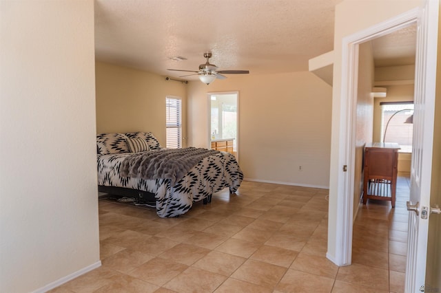10453 S Del Rico, Yuma, AZ 85367 - bedroom with light tile patterned floors, baseboards, ceiling fan, and a textured ceiling
