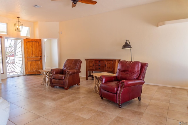 10453 S Del Rico, Yuma, AZ 85367 - sitting room with baseboards, visible vents, light tile patterned floors, and ceiling fan with notable chandelier