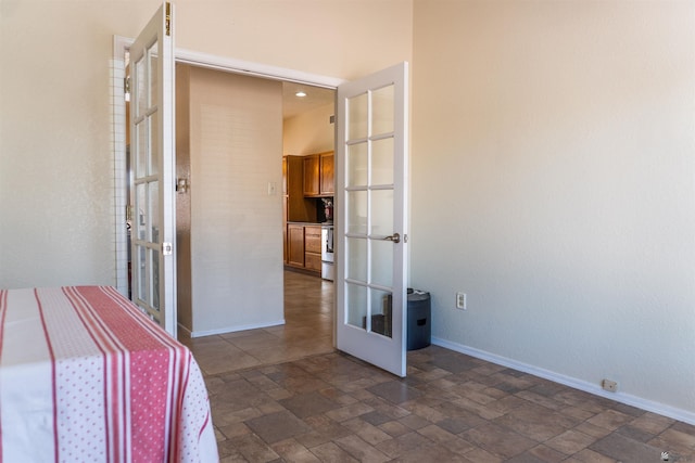 10453 S Del Rico, Yuma, AZ 85367 - unfurnished bedroom with baseboards, stone finish floor, and french doors
