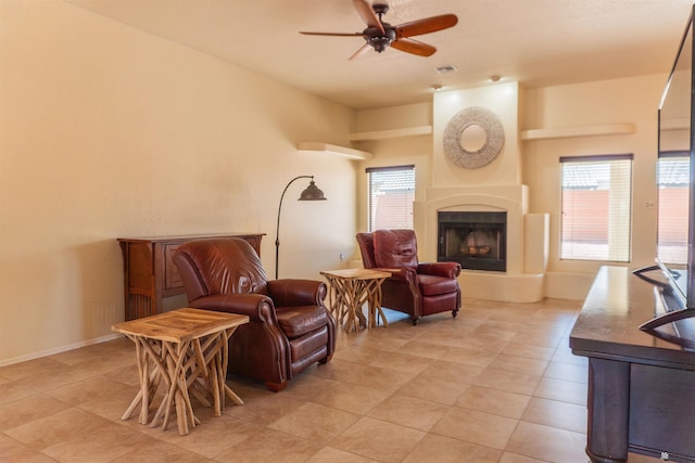 10453 S Del Rico, Yuma, AZ 85367 - living room featuring light tile patterned floors, a fireplace with raised hearth, a ceiling fan, and visible vents
