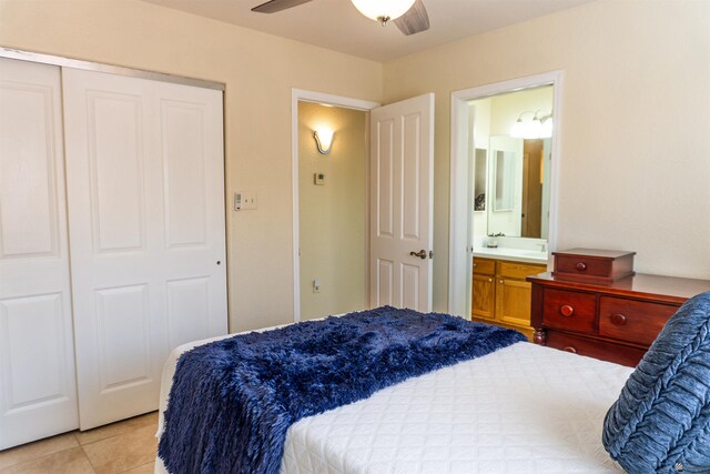 10453 S Del Rico, Yuma, AZ 85367 - bedroom featuring a closet, a ceiling fan, connected bathroom, and light tile patterned floors