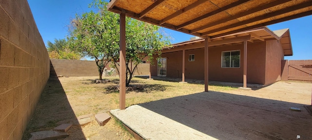 view of yard featuring a fenced backyard and a patio area