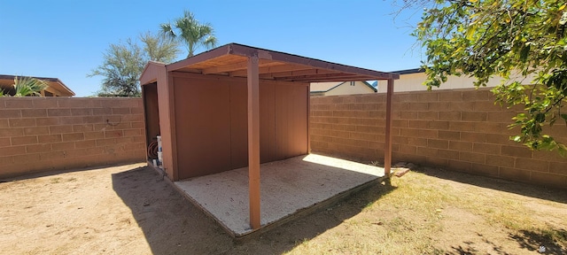 view of shed featuring a fenced backyard
