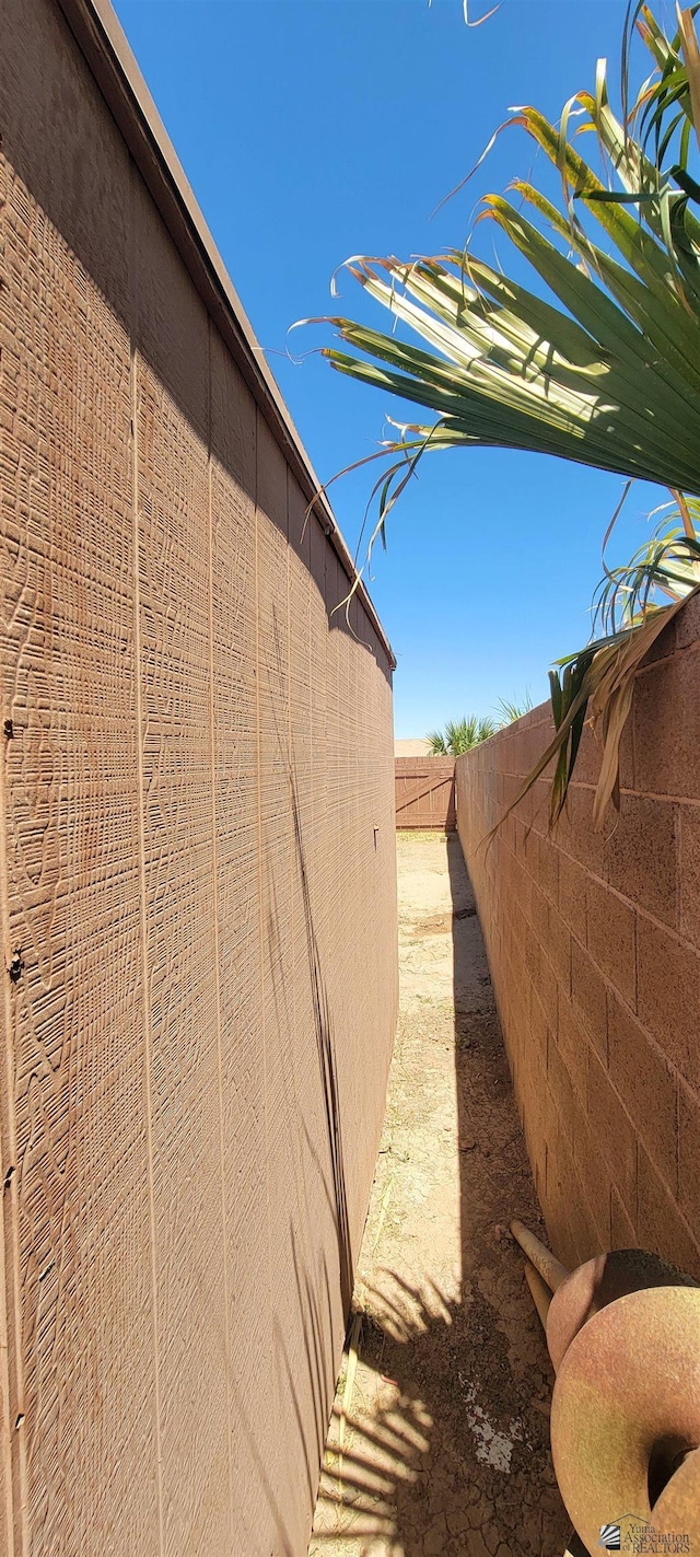 view of side of home with fence