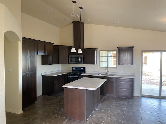 kitchen with a center island, black range oven, sink, hanging light fixtures, and dark brown cabinetry