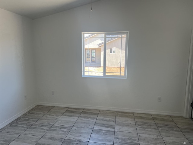 unfurnished room with light tile patterned floors