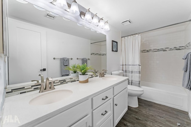 2032 W 13th Ln, Yuma, AZ 85364 - bathroom featuring toilet, shower / tub combo, wood finished floors, and double vanity