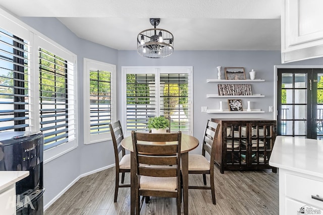 2032 W 13th Ln, Yuma, AZ 85364 - dining space with wood finished floors, a chandelier, and baseboards