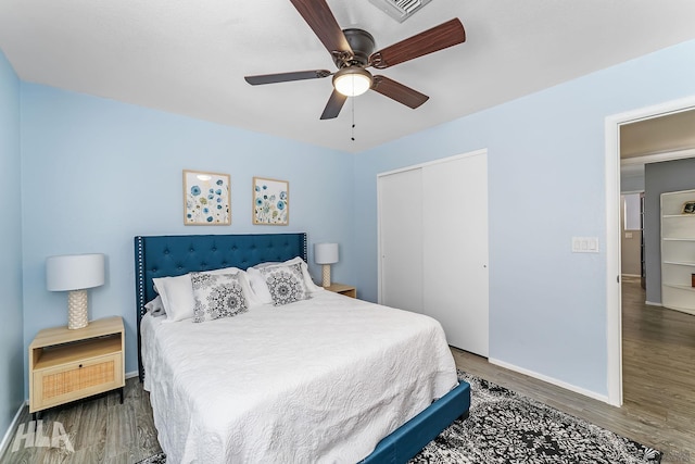 2032 W 13th Ln, Yuma, AZ 85364 - bedroom featuring baseboards, wood finished floors, a closet, and ceiling fan