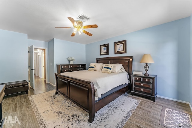 2032 W 13th Ln, Yuma, AZ 85364 - bedroom with wood finished floors, baseboards, and ceiling fan