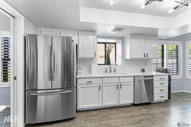 2032 W 13th Ln, Yuma, AZ 85364 - kitchen featuring stainless steel appliances, a sink, white cabinetry, and light countertops