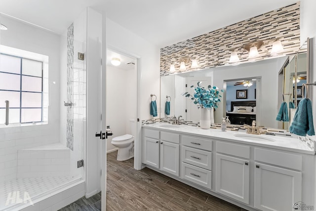 2032 W 13th Ln, Yuma, AZ 85364 - full bathroom featuring ceiling fan, a shower stall, double vanity, toilet, and ensuite bathroom