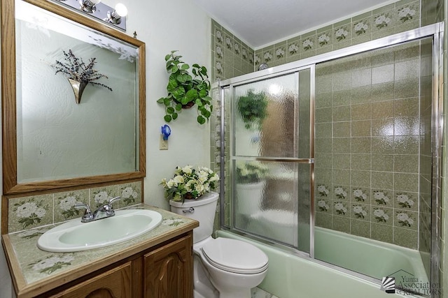 1376 S Hettema St, Yuma, AZ 85364 - bathroom featuring toilet, vanity, and bath / shower combo with glass door