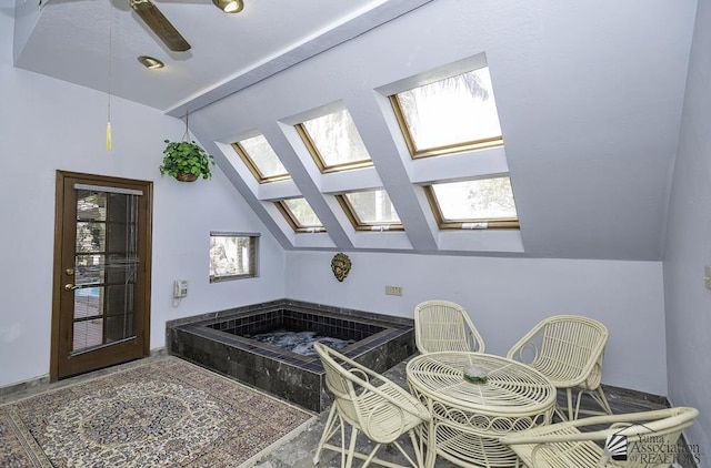 1376 S Hettema St, Yuma, AZ 85364 - bathroom with vaulted ceiling, a skylight, healthy amount of natural light, a ceiling fan, and a tub to relax in