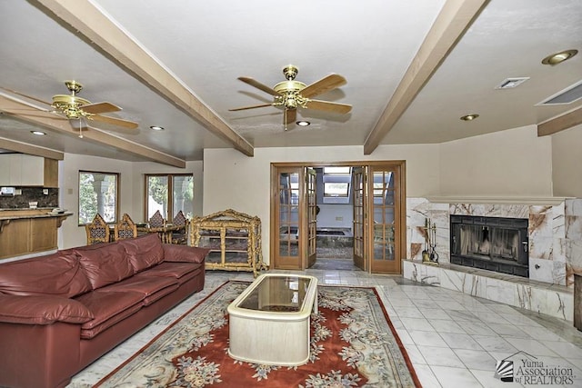 1376 S Hettema St, Yuma, AZ 85364 - living area with a ceiling fan, beamed ceiling, a premium fireplace, recessed lighting, and marble finish flooring