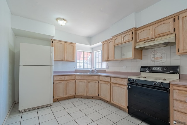 2320 S Maple Ave, Yuma, AZ 85364 - kitchen featuring freestanding refrigerator, electric range oven, under cabinet range hood, light brown cabinetry, and a sink