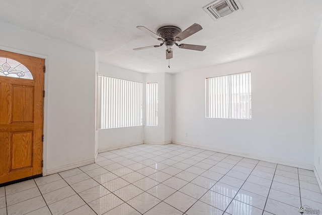 2320 S Maple Ave, Yuma, AZ 85364 - entrance foyer featuring a ceiling fan, light tile patterned flooring, and baseboards