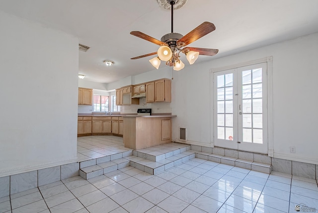2320 S Maple Ave, Yuma, AZ 85364 - kitchen with light brown cabinetry, light tile patterned floors, a peninsula, and a ceiling fan