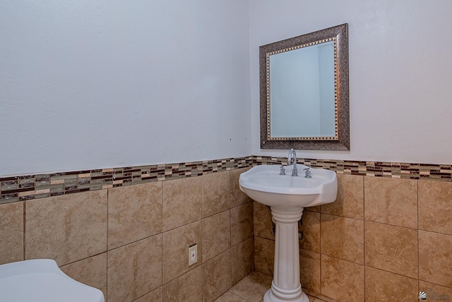 2320 S Maple Ave, Yuma, AZ 85364 - half bathroom with tile walls and a wainscoted wall