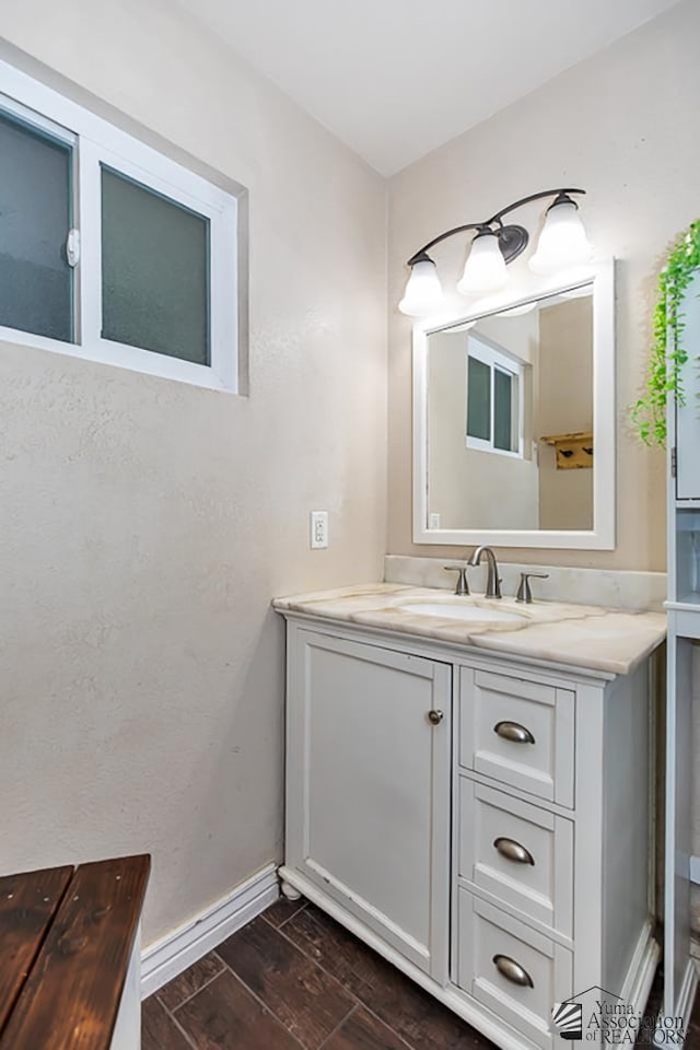 1830 W Allen St, Yuma, AZ 85364 - bathroom featuring vanity and wood finished floors