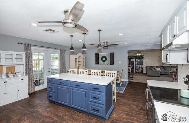 1830 W Allen St, Yuma, AZ 85364 - kitchen with ceiling fan, blue cabinets, electric stove, white cabinetry, and recessed lighting