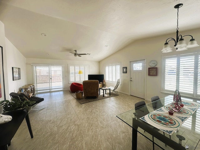 13624 E 47th St, Yuma, AZ 85367 - living area with baseboards, lofted ceiling, and ceiling fan with notable chandelier