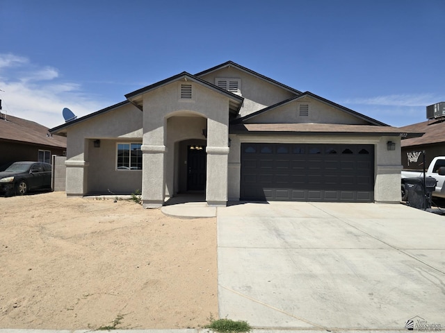 3822 E San Francisco St, San Luis, AZ 85336 - ranch-style home with an attached garage, central AC, stucco siding, and driveway