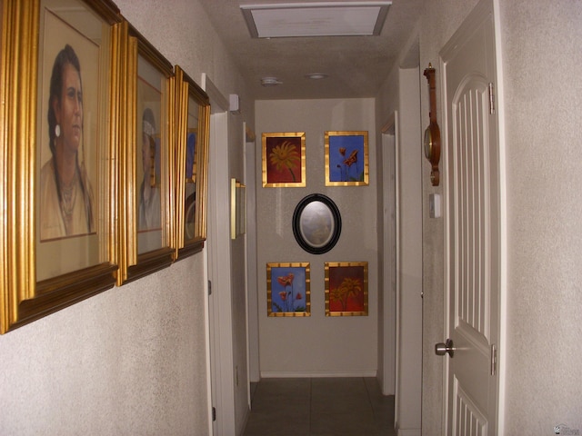 12650 E 46th St, Yuma, AZ 85367 - hall with tile patterned floors and a textured wall