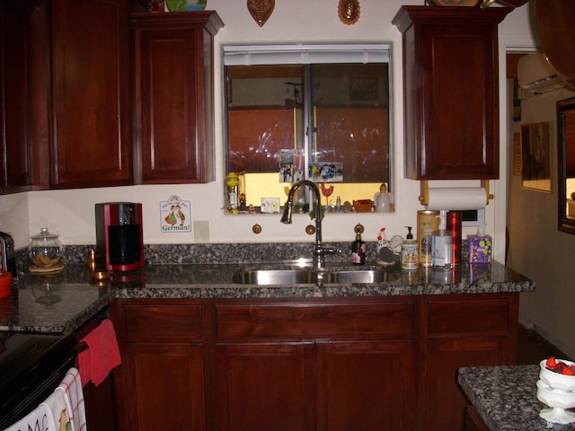 12650 E 46th St, Yuma, AZ 85367 - kitchen featuring dark stone counters, reddish brown cabinets, and black electric range
