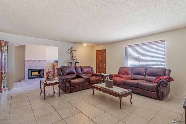 1871 S Mckinley Ave, Yuma, AZ 85364 - living area with light tile patterned floors, a fireplace, and a textured ceiling