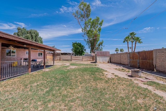 1871 S Mckinley Ave, Yuma, AZ 85364 - view of yard featuring a patio and a storage unit