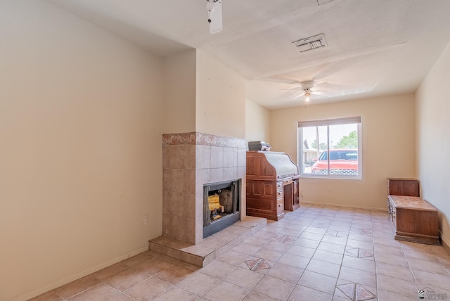 1871 S Mckinley Ave, Yuma, AZ 85364 - living room with ceiling fan, baseboards, a fireplace, and light tile patterned floors