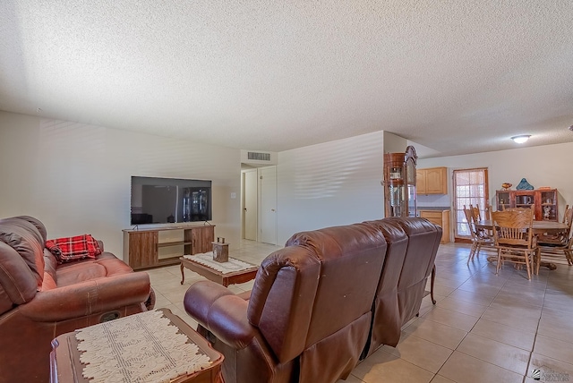 1871 S Mckinley Ave, Yuma, AZ 85364 - living area with light tile patterned floors and a textured ceiling