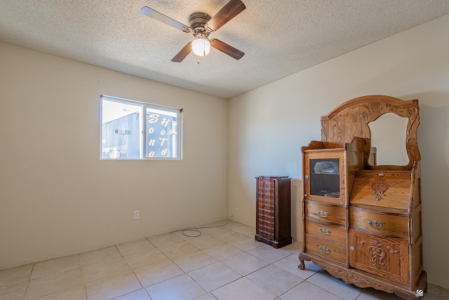 1871 S Mckinley Ave, Yuma, AZ 85364 - bedroom with a textured ceiling, a ceiling fan, and light tile patterned floors