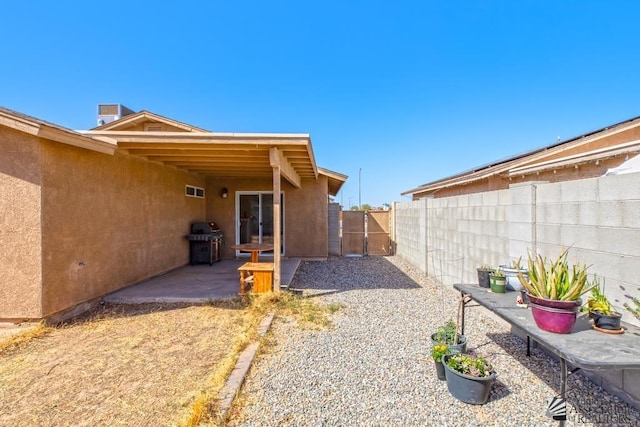view of yard with a fenced backyard and a patio