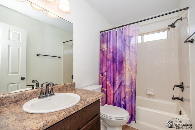 full bathroom with vanity, toilet, and shower / tub combo with curtain