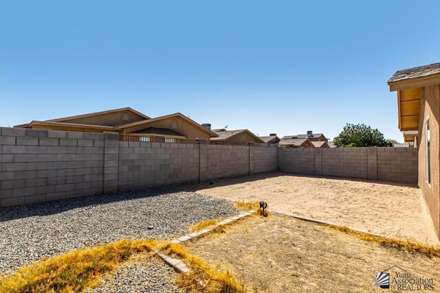 view of yard with a fenced backyard and a patio area