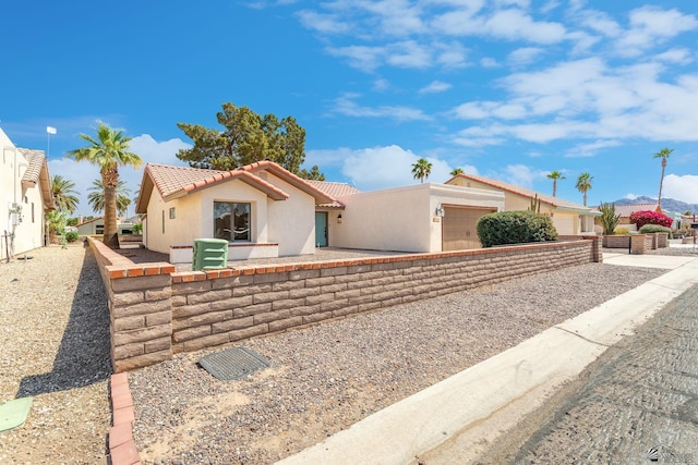 12500 E Del Rico, Yuma, AZ 85367 - view of front of property featuring a garage, stucco siding, and a tile roof